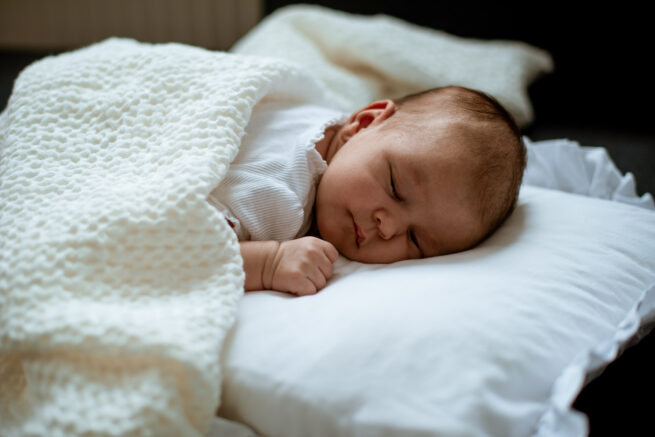 Baby wrapped in Waffle Linien Baby Blanket - Cream